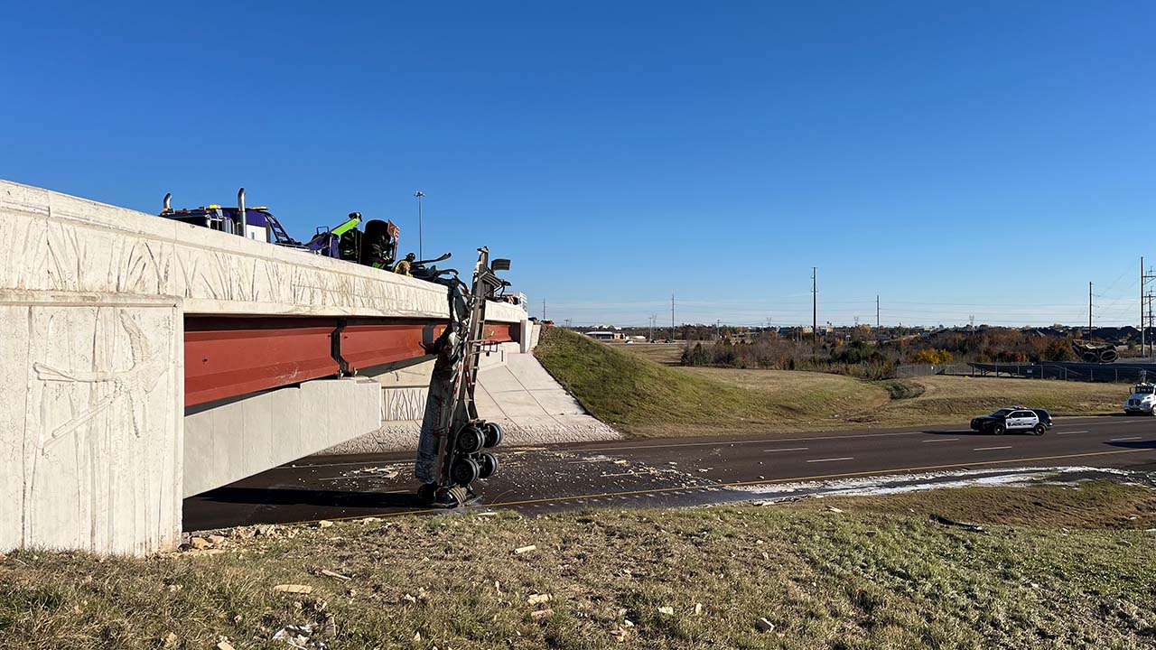 Semi-Truck Crashes On I-35 Bridge, Dangles Over The Edge; Northbound Traffic Closed