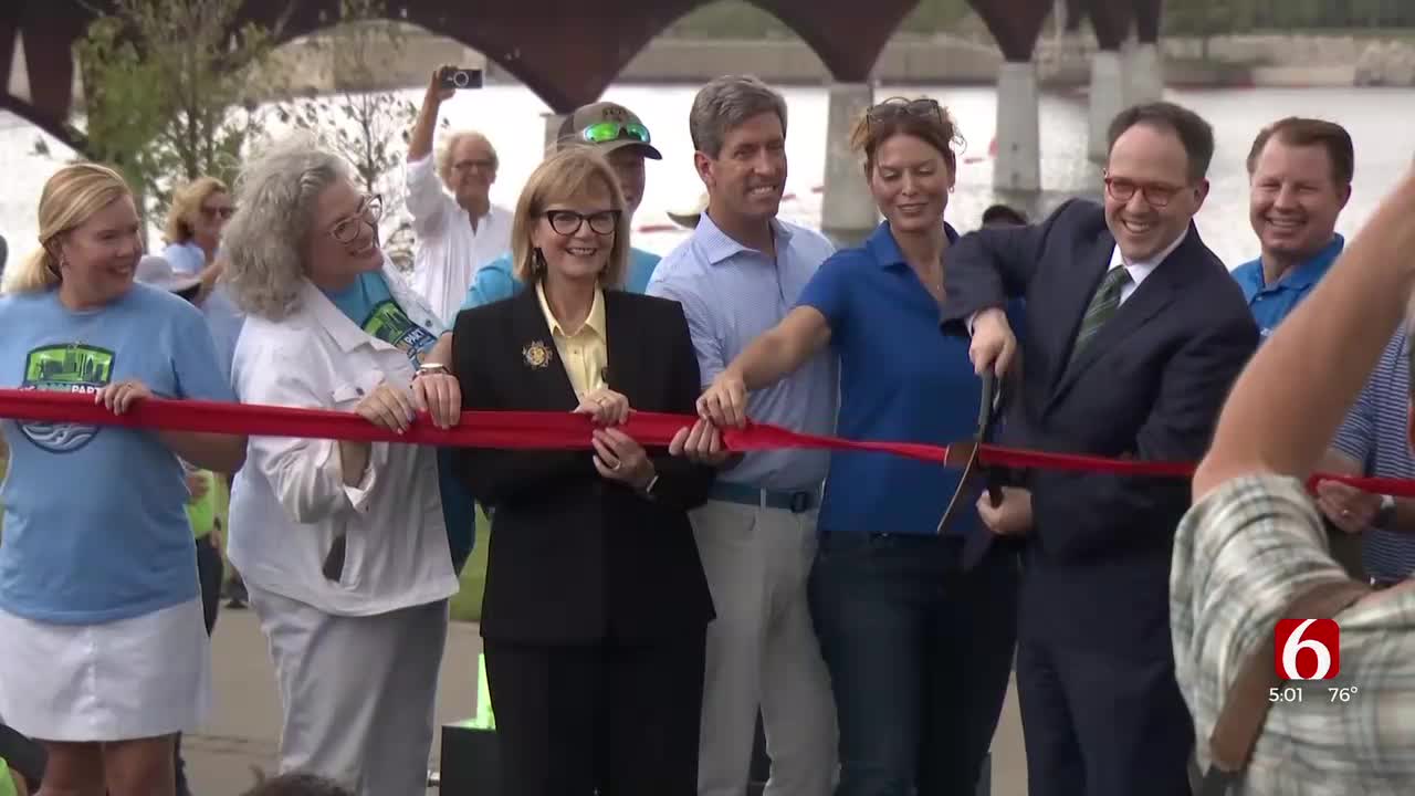 Zink Lake Cuts Ribbon For Grand Opening